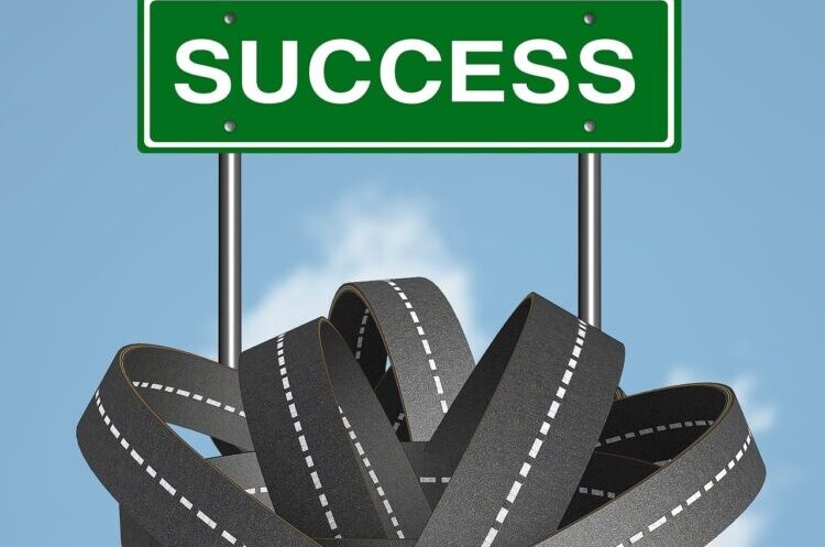 Green success sign and blue sky