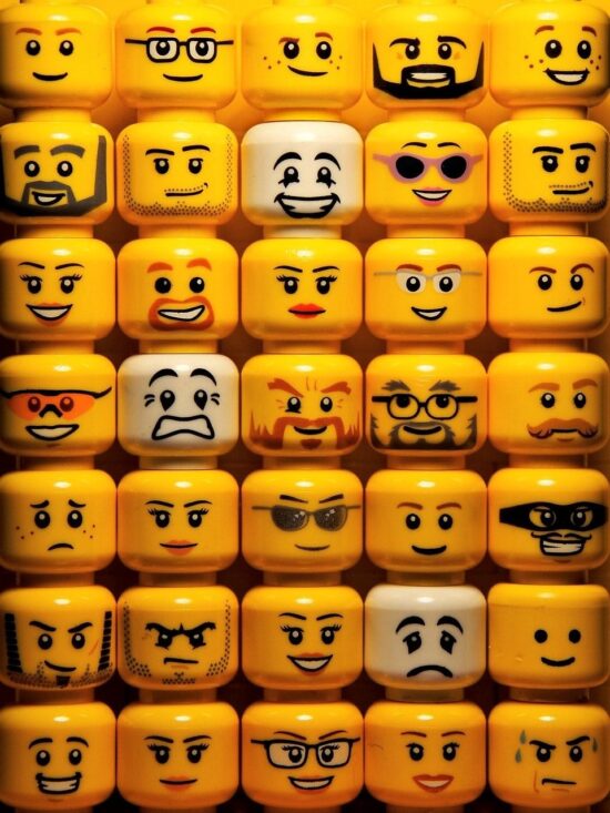 Rows and rows of yellow characterful lego faces