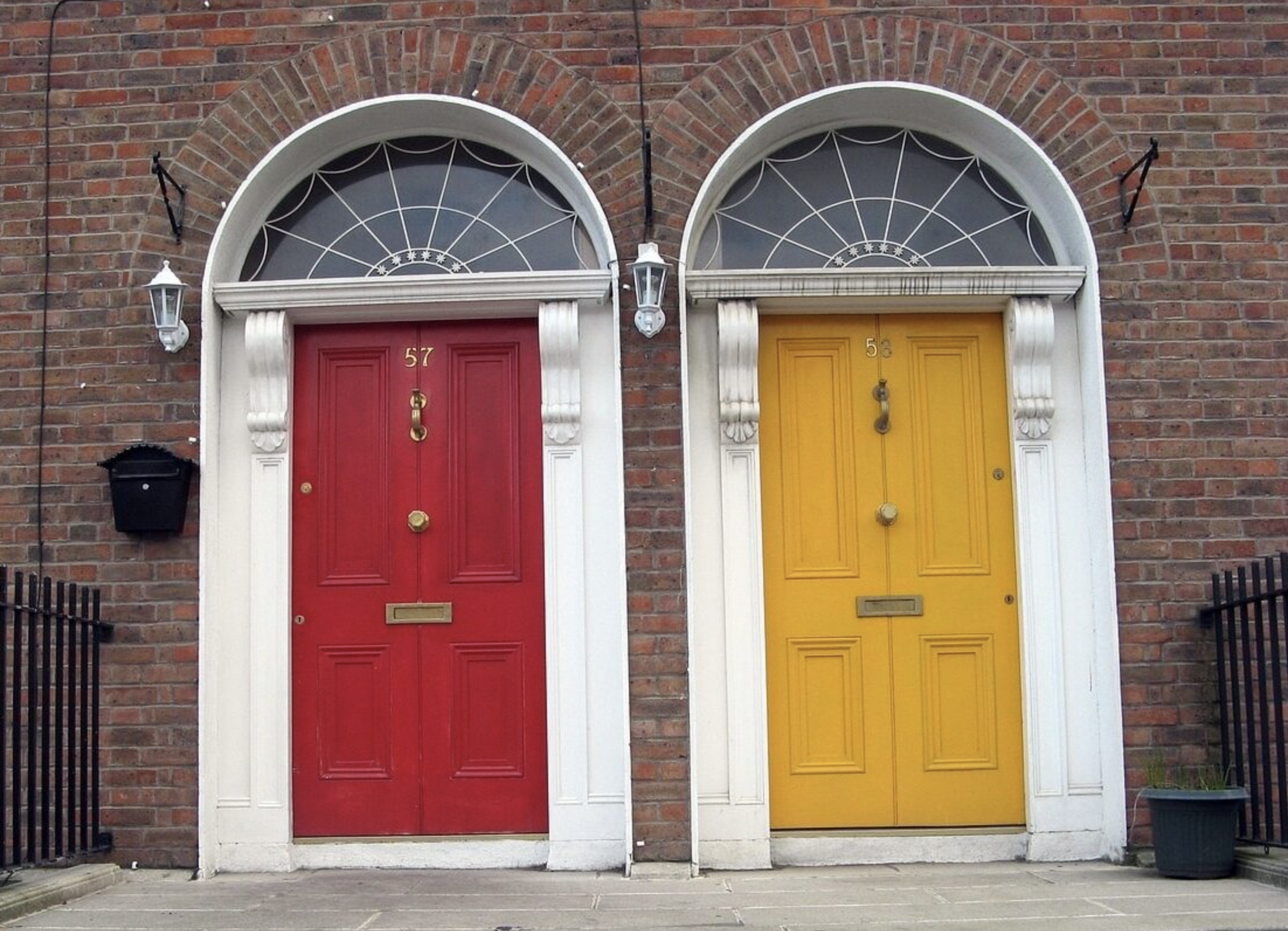 Two grand red and yellow front doors