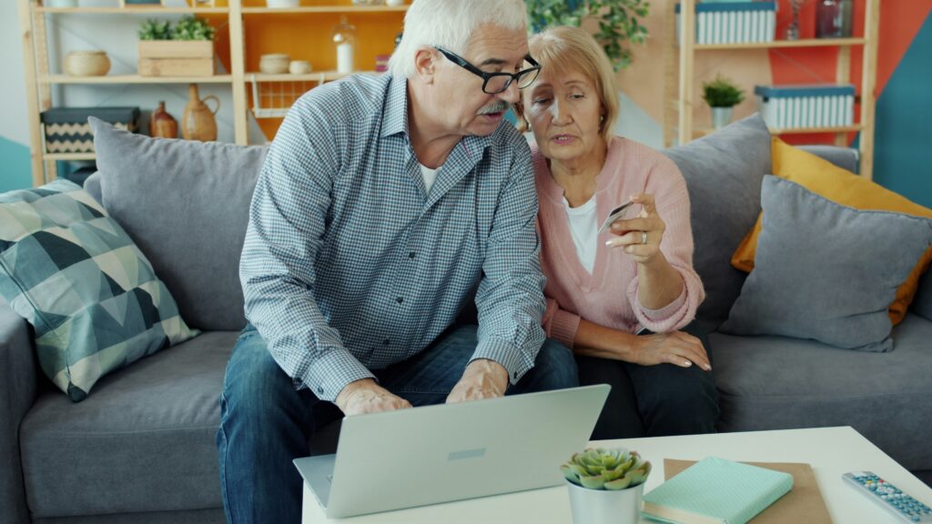 Couple discussing finances in their home